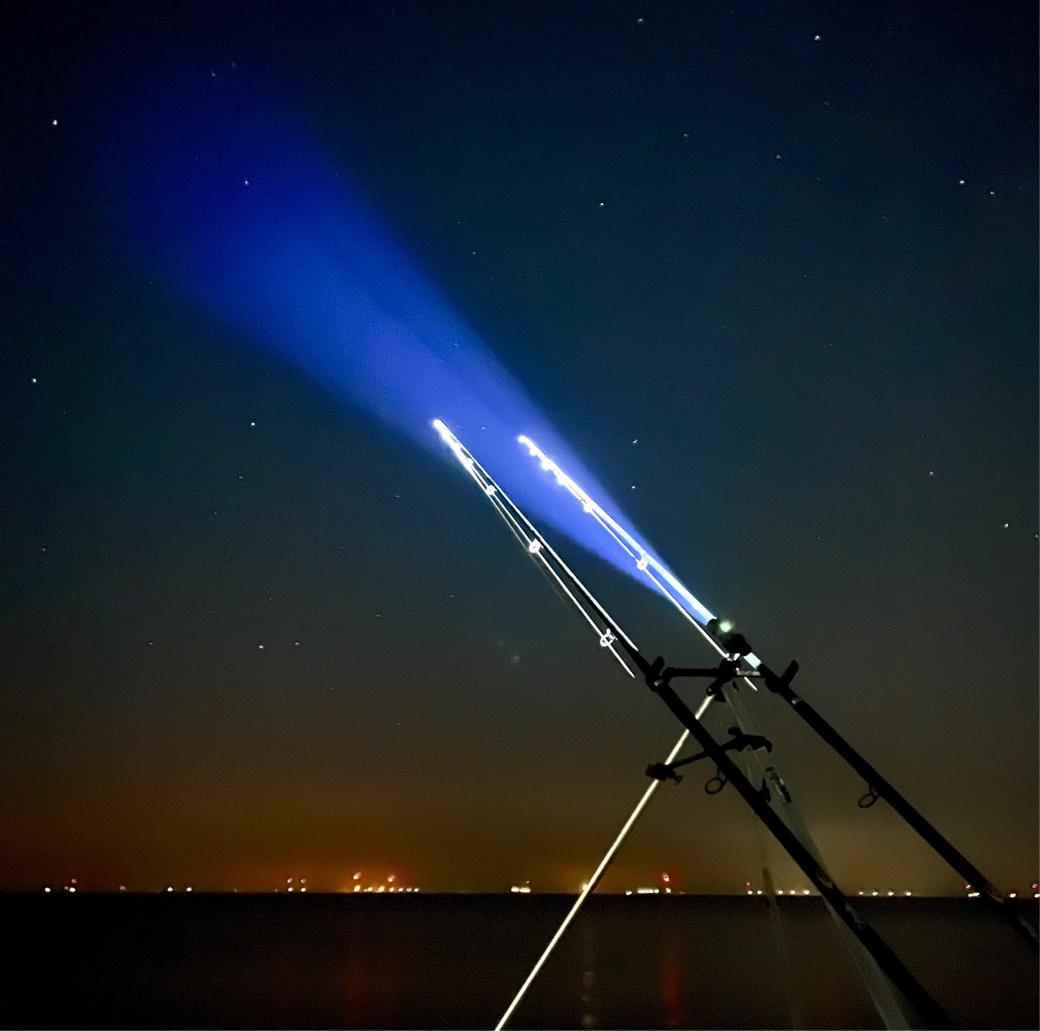 Sea fishing rod tip lights, tripod torch, night view